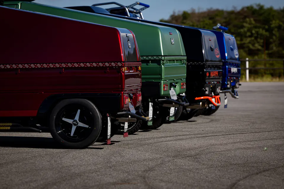 Customized Kei Trucks with enclosed box bodies parked in a row