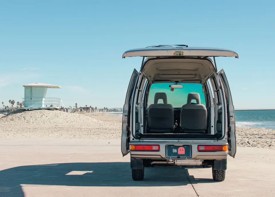 Honda Acty Street Kei Van with the rear hatch open showing the seats and cargo area
