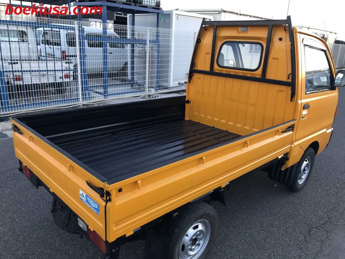 1993 Mitsubishi Minicab 4x4, a yellow ii Kei Truck, for sale at Boeki USA in Paterson, NJ (photo 4 of 20)