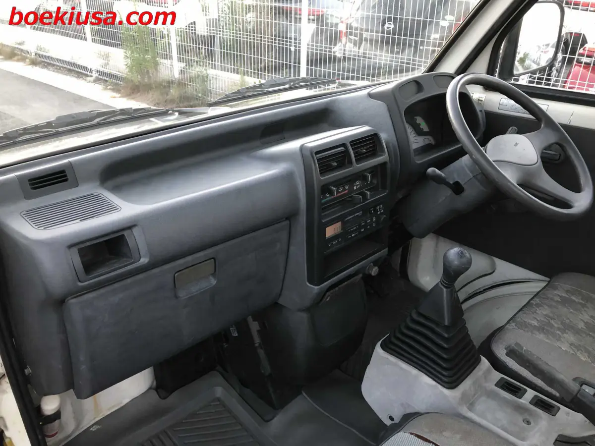 1993 Mitsubishi Minicab 4x4, a yellow ii Kei Truck, for sale at Boeki USA in Paterson, NJ (photo 9 of 20)