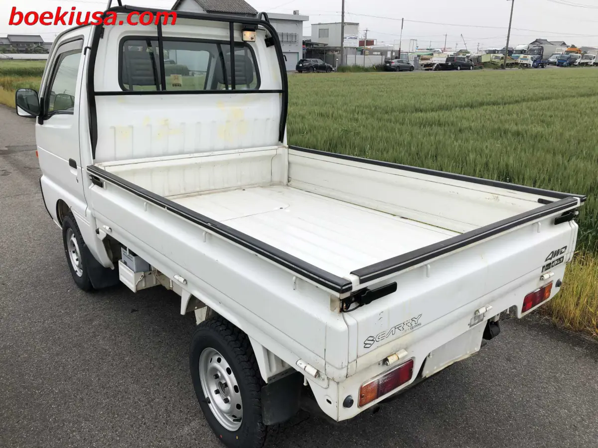 1996 Suzuki Carry 4x4, a white Kei Truck, for sale at Boeki USA in Paterson, NJ (photo 3 of 20)