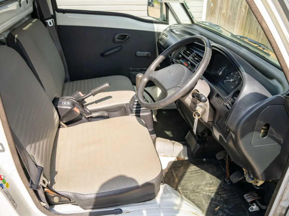 1996 Suzuki Carry, a gray Kei Truck, for sale at Japan Direct Motors in Irmo, SC (photo 11 of 13)
