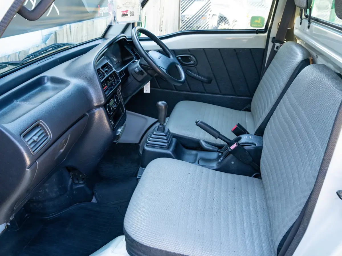 1996 Suzuki Carry, a green Kei Truck, for sale at Japan Direct Motors in Irmo, SC (photo 12 of 16)