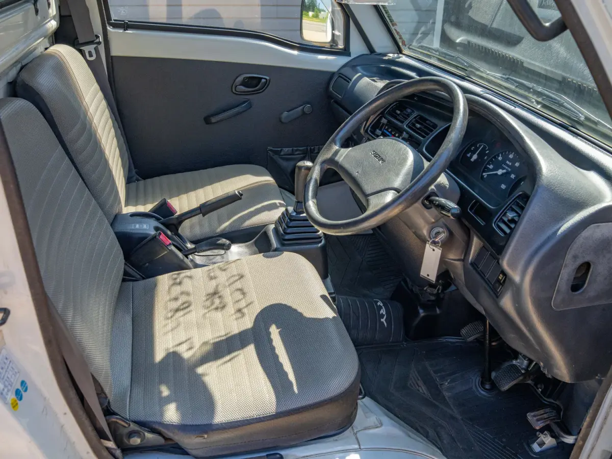 1997 Suzuki Carry 25k Miles, a white Kei Truck, for sale at Japan Direct Motors in Irmo, SC (photo 11 of 13)