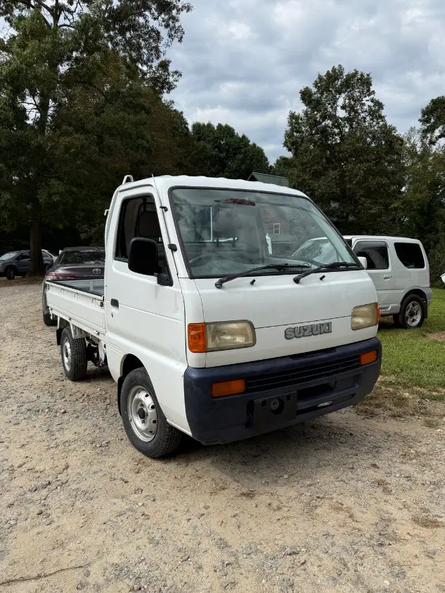 1997 Suzuki Carry 4WD, a white Kei Truck, for sale at Mayberry Mini Trucks in Mount Airy, NC (photo 3 of 18)