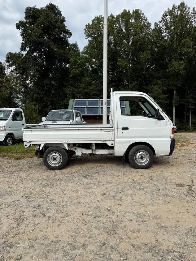 1997 Suzuki Carry 4WD, a white Kei Truck, for sale at Mayberry Mini Trucks in Mount Airy, NC (photo 4 of 18)