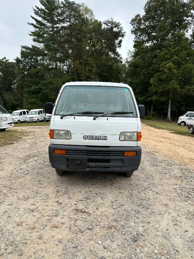 1997 Suzuki Carry Dump 4WD, a white Kei Truck, for sale at Mayberry Mini Trucks in Mount Airy, NC (photo 4 of 20)