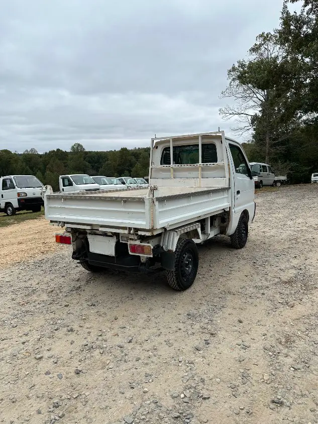 1997 Suzuki Carry Dump 4WD, a white Kei Truck, for sale at Mayberry Mini Trucks in Mount Airy, NC (photo 7 of 20)