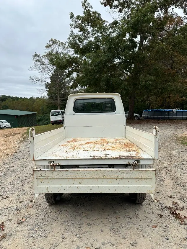 1997 Suzuki Carry Dump 4WD, a white Kei Truck, for sale at Mayberry Mini Trucks in Mount Airy, NC (photo 9 of 20)