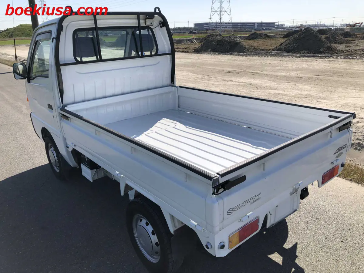1998 Suzuki Carry 4x4, a white Kei Truck, for sale at Boeki USA in Paterson, NJ (photo 3 of 20)