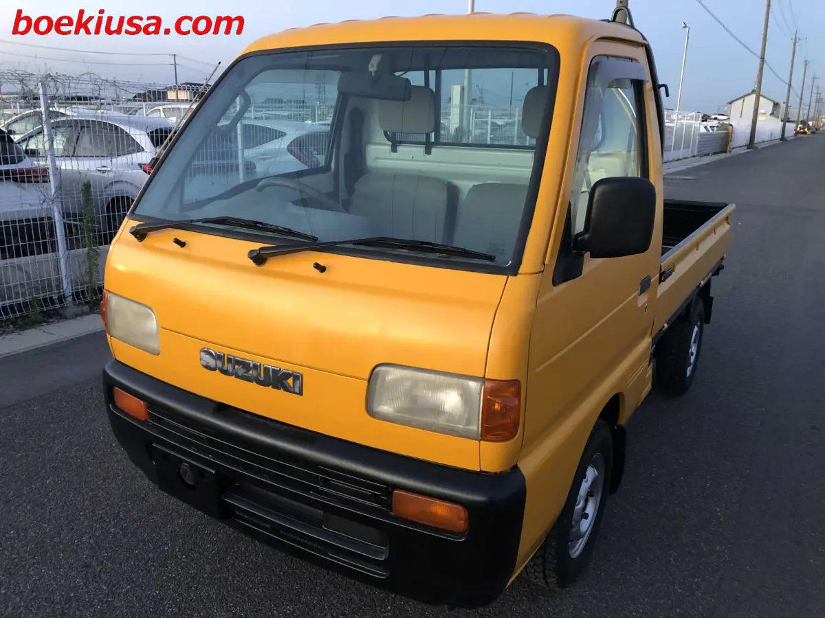1998 Suzuki Carry 4x4, a yellow ii Kei Truck, for sale at Boeki USA in Paterson, NJ (photo 2 of 20)