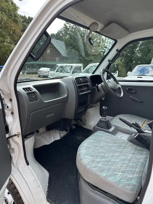 1999 Suzuki Carry 4WD, a white Kei Truck, for sale at Mayberry Mini Trucks in Mount Airy, NC (photo 16 of 20)