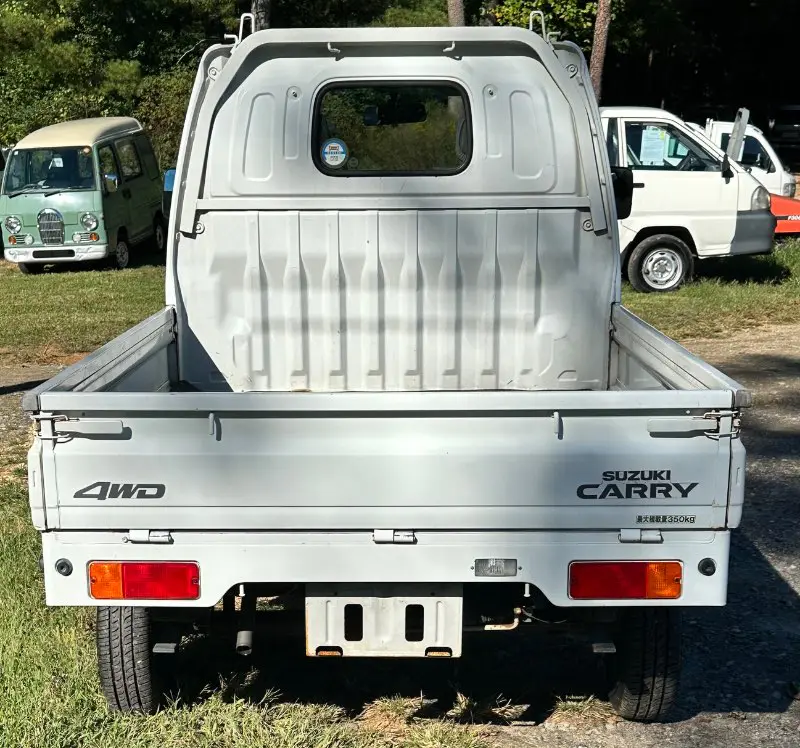 1999 Suzuki Carry 4WD, a white Kei Truck, for sale at Mayberry Mini Trucks in Mount Airy, NC (photo 6 of 17)