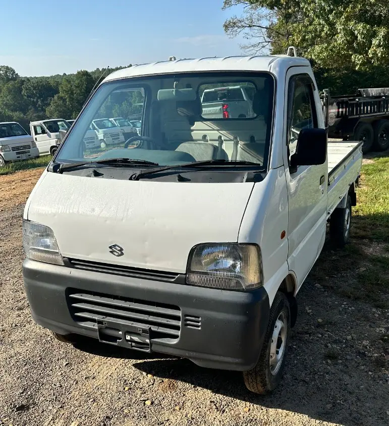 1999 Suzuki Carry 4WD, a white Kei Truck, for sale at Mayberry Mini Trucks in Mount Airy, NC (photo 1 of 18)