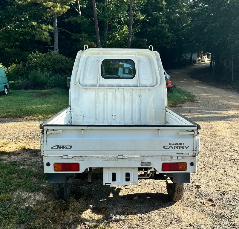 1999 Suzuki Carry 4WD, a white Kei Truck, for sale at Mayberry Mini Trucks in Mount Airy, NC (photo 4 of 18)