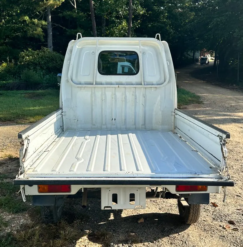 1999 Suzuki Carry 4WD, a white Kei Truck, for sale at Mayberry Mini Trucks in Mount Airy, NC (photo 5 of 18)