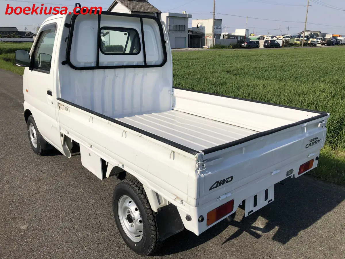1999 Suzuki Carry 4x4, a white Kei Truck, for sale at Boeki USA in Paterson, NJ (photo 3 of 20)