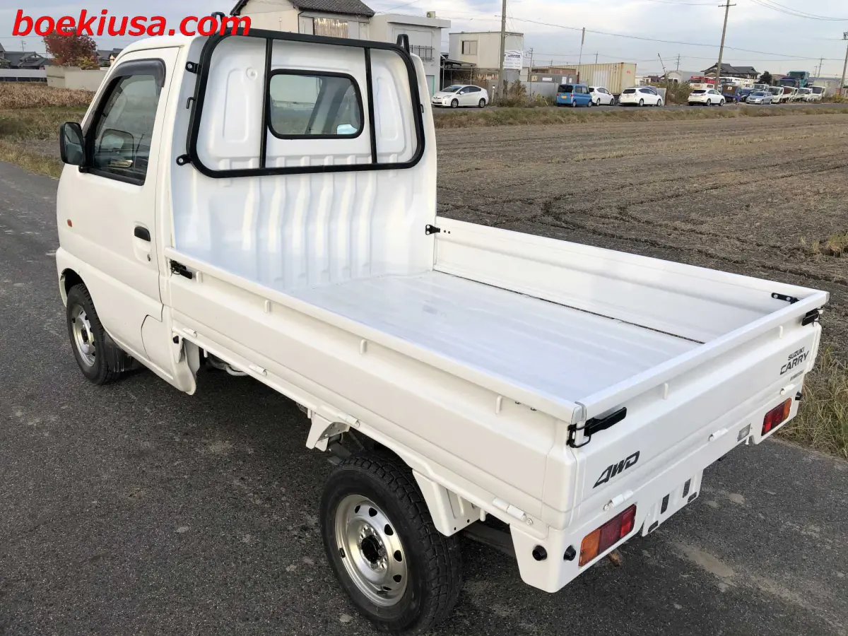 1999 Suzuki Carry 4x4, a white Kei Truck, for sale at Boeki USA in Paterson, NJ (photo 3 of 20)