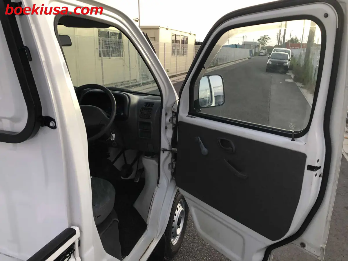 1999 Suzuki Carry 4x4, a white Kei Truck, for sale at Boeki USA in Paterson, NJ (photo 12 of 20)