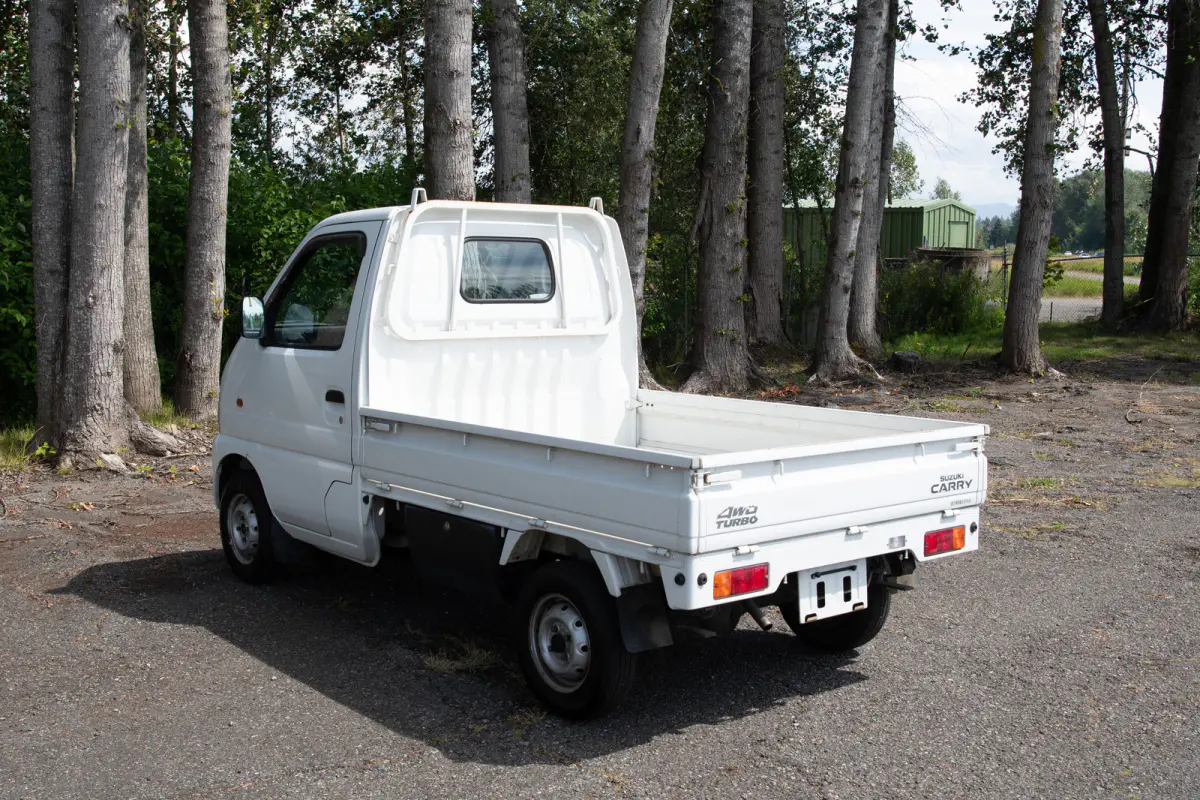 1999 Suzuki Carry Turbo, a gray Kei Truck, for sale at The Import Guys in Ferndale, WA (photo 4 of 12)