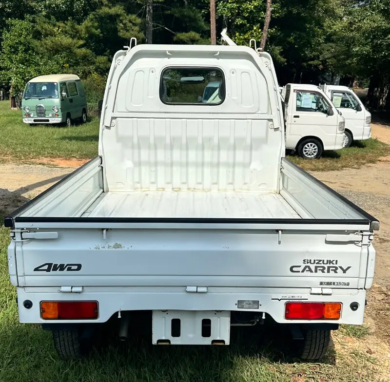 2000 Suzuki Carry 4WD, a white Kei Truck, for sale at Mayberry Mini Trucks in Mount Airy, NC (photo 5 of 12)