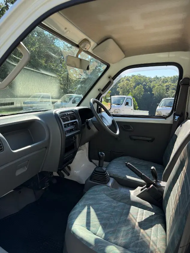 2000 Suzuki Carry 4WD, a white Kei Truck, for sale at Mayberry Mini Trucks in Mount Airy, NC (photo 9 of 16)
