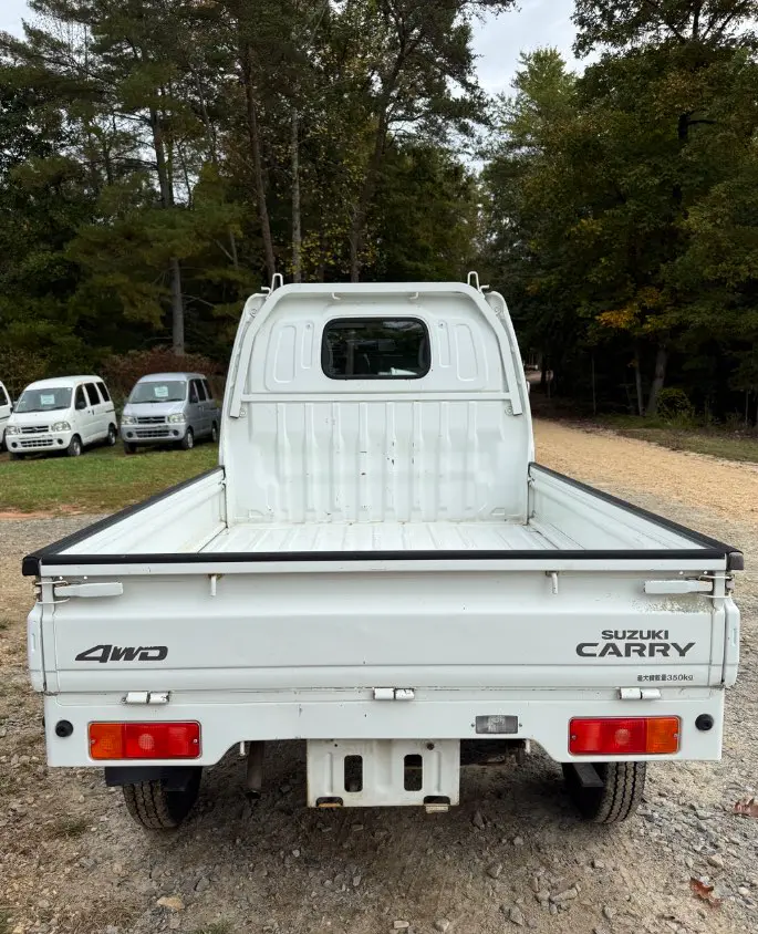 2000 Suzuki Carry 4WD, a white Kei Truck, for sale at Mayberry Mini Trucks in Mount Airy, NC (photo 6 of 18)