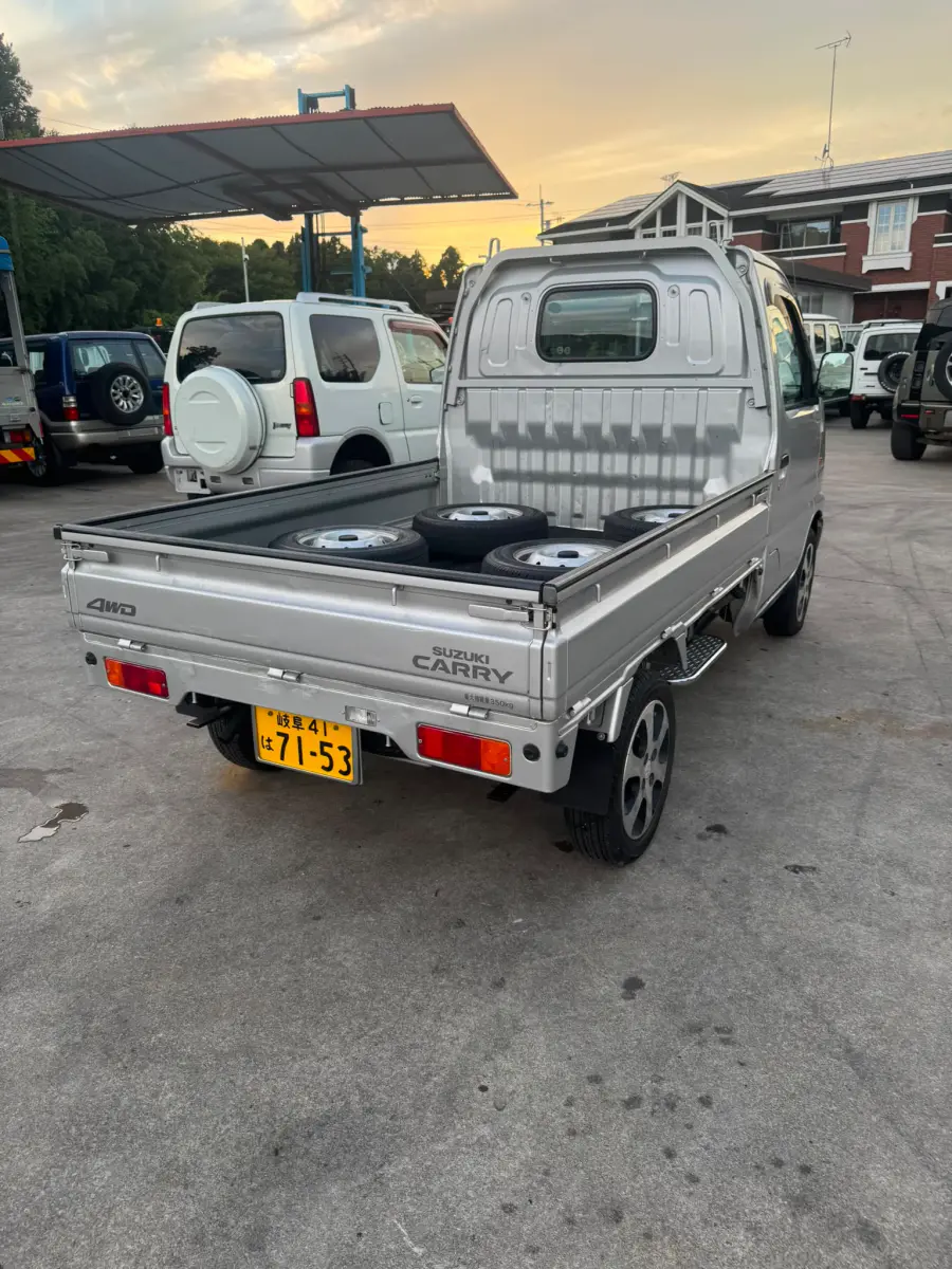 2000 Suzuki Carry 4x4, a silver Kei Truck, for sale at Skyline Kei Trucks in Houston, TX (photo 4 of 10)