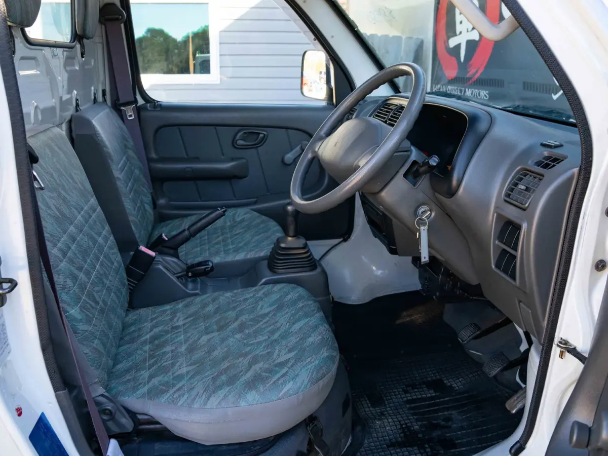 2000 Suzuki Carry, a white Kei Truck, for sale at Japan Direct Motors in Irmo, SC (photo 11 of 13)