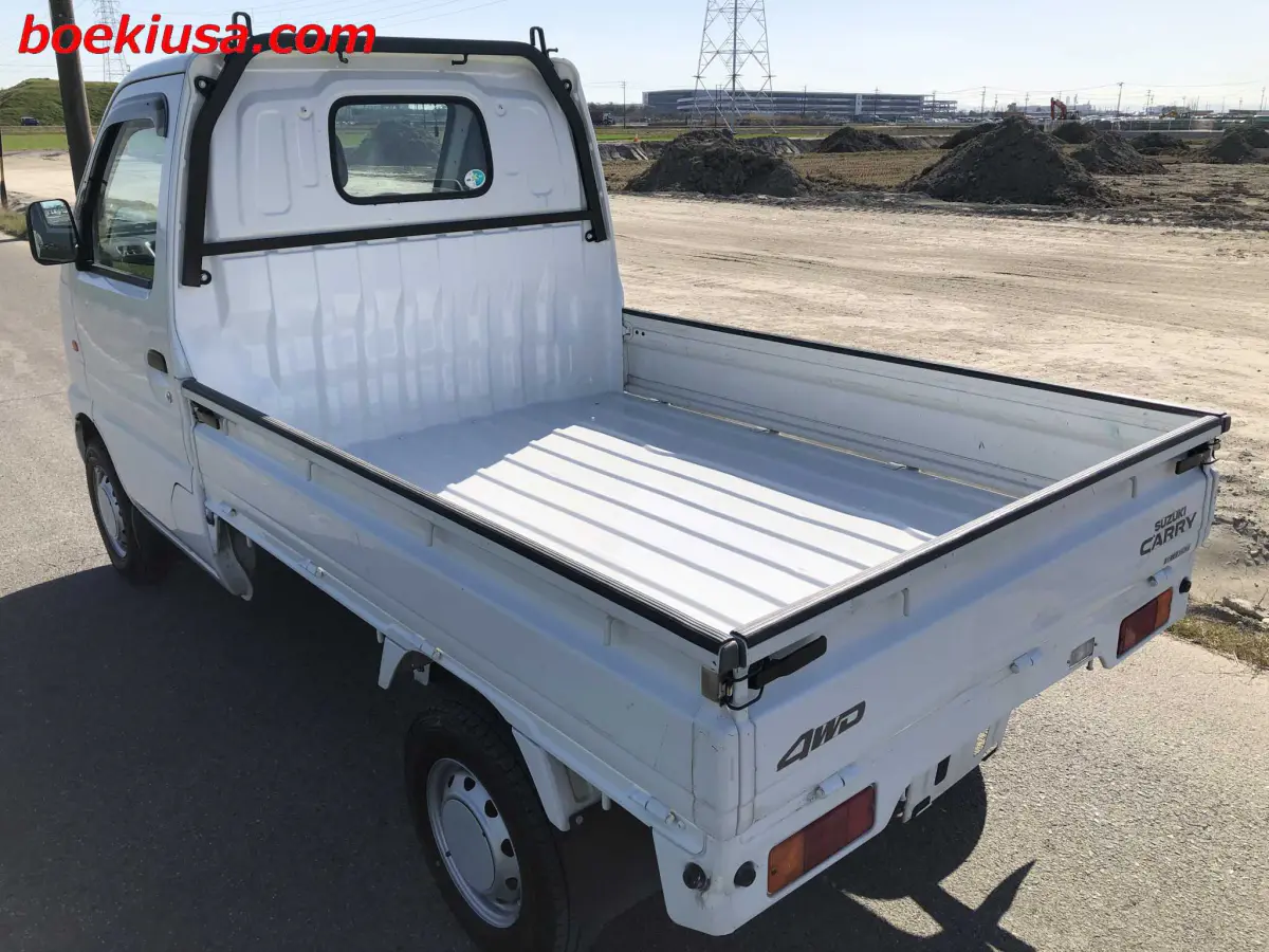 2001 Suzuki Carry 4x4, a white Kei Truck, for sale at Boeki USA in Paterson, NJ (photo 3 of 20)