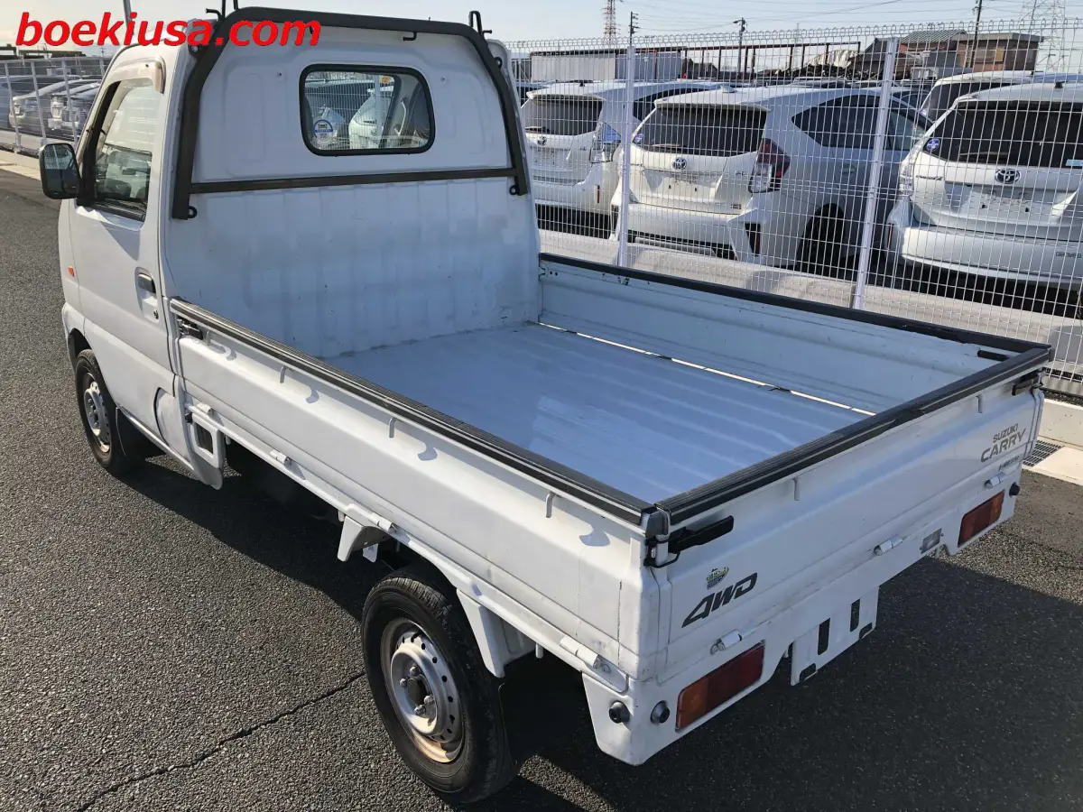 2001 Suzuki Carry 4x4, a white Kei Truck, for sale at Boeki USA in Paterson, NJ (photo 3 of 20)