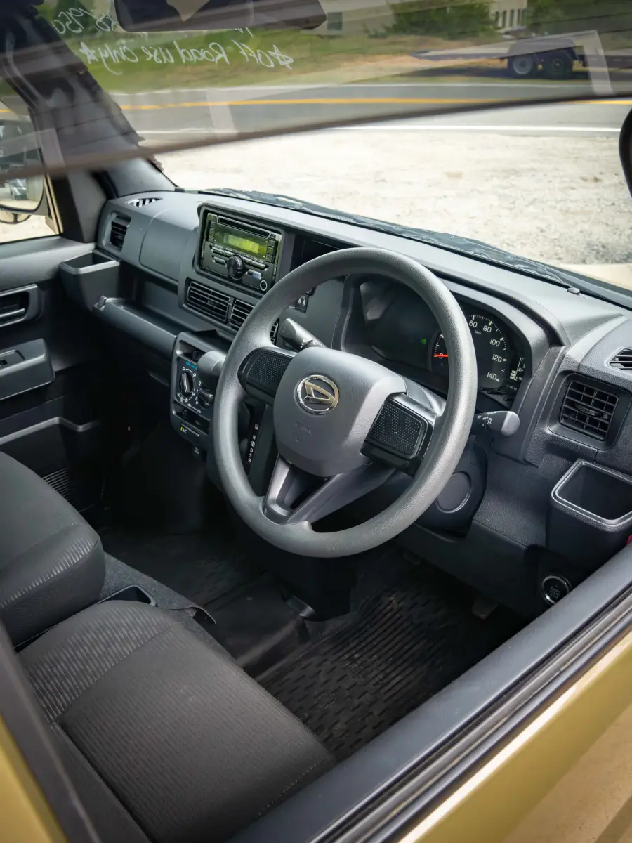 2023 Daihatsu Hijet Deckvan, a green off-road Kei Truck, for sale at Japan Direct Motors in Irmo, SC (photo 12 of 21)