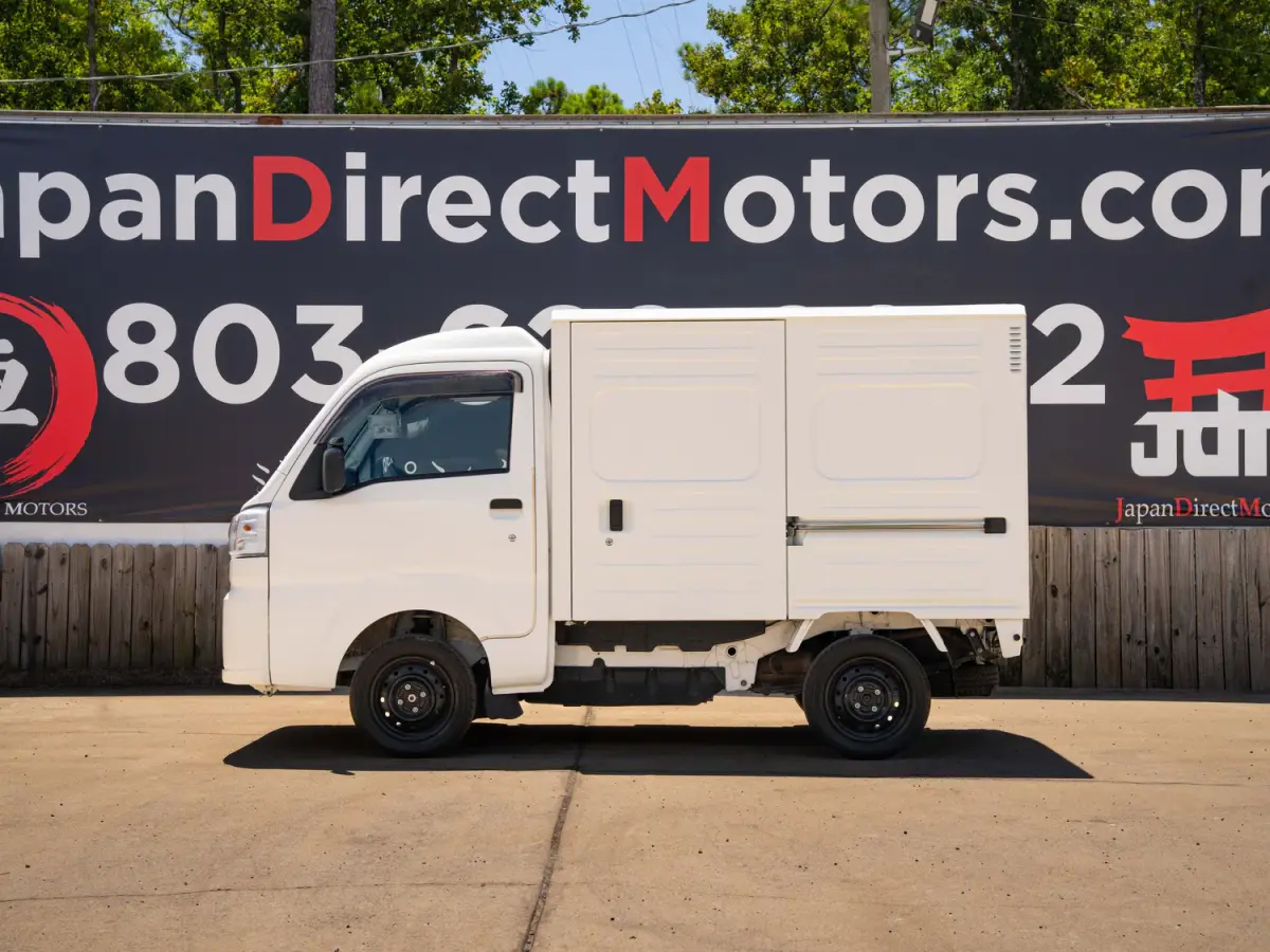 2023 Daihatsu Hijet, a black off-road Kei Truck, for sale at Japan Direct Motors in Irmo, SC (photo 10 of 19)
