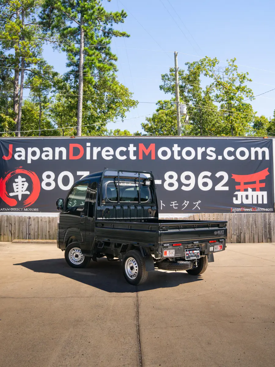 2024 Daihatsu Hijet, a black off-road Kei Truck, for sale at Japan Direct Motors in Irmo, SC (photo 2 of 13)