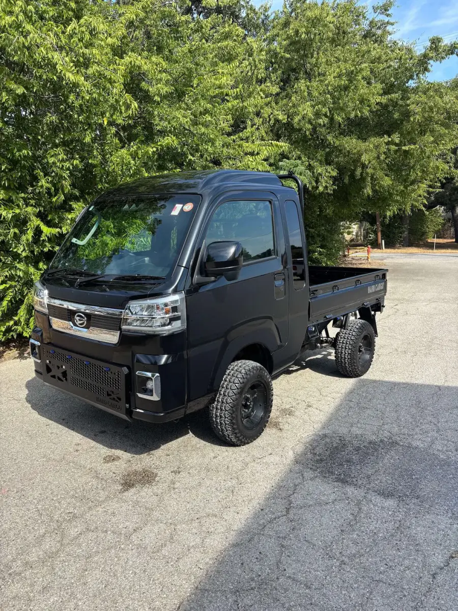 2025 Daihatsu Hijet Jumbo Hard Cargo Edition, a black off-road Kei Truck, for sale at Weatherford Mini Trucks in Weatherford, TX (photo 1 of 8)