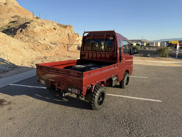 2025 Daihatsu Hijet Jumbo, a red off-road Kei Truck, for sale at Mini Monsters USA in St. George, UT (photo 3 of 23)