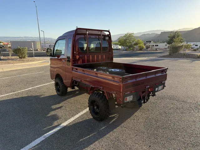 2025 Daihatsu Hijet Jumbo, a red off-road Kei Truck, for sale at Mini Monsters USA in St. George, UT (photo 4 of 23)