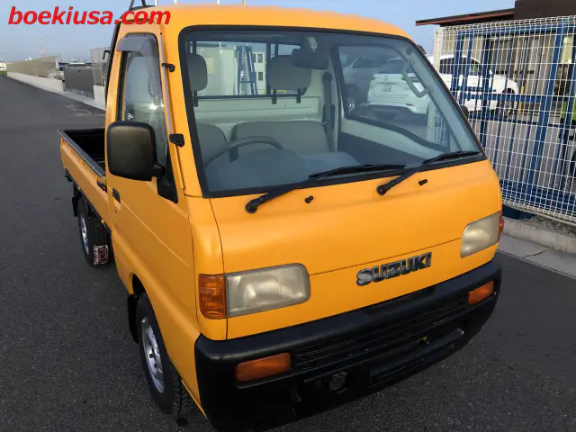 1998 Suzuki Carry 4x4, a yellow ii Kei Truck, for sale at Boeki USA in Paterson, NJ