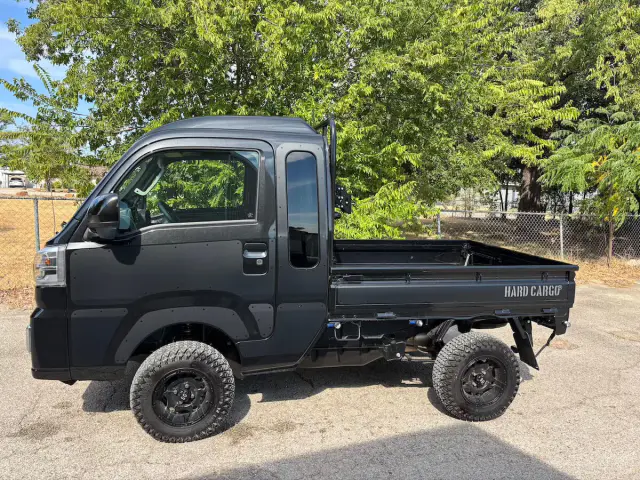 2025 Daihatsu Hijet Jumbo Hard Cargo Edition, a black off-road Kei Truck, for sale at Weatherford Mini Trucks in Weatherford, TX